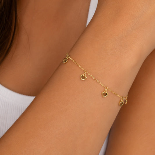 PULSEIRA COM CORAÇÕES DOURADA