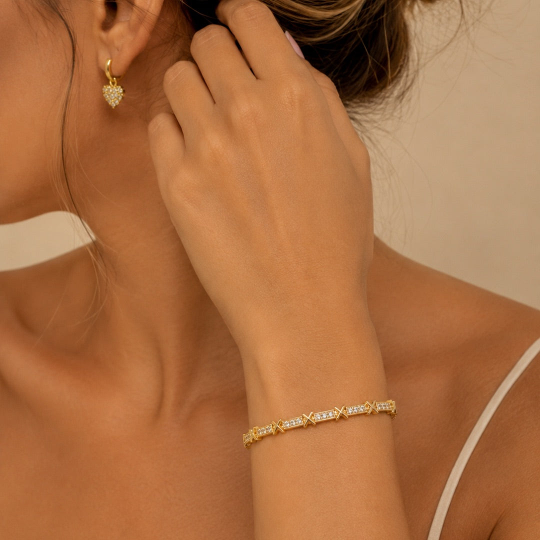 PULSEIRA DOURADA COM DETALHE EM X